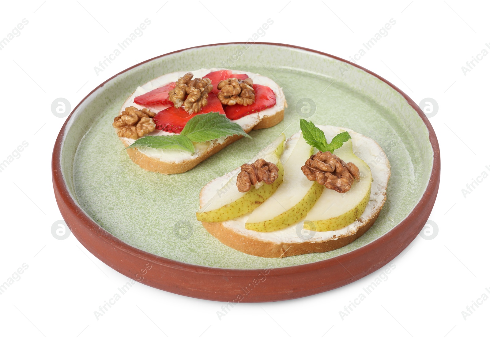 Photo of Delicious bruschettas with ricotta cheese, pear, strawberries, mint and walnuts isolated on white