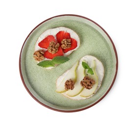 Photo of Delicious bruschettas with ricotta cheese, pear, strawberries, mint and walnuts isolated on white, top view