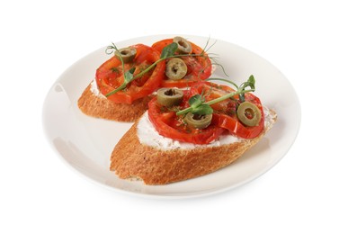 Delicious ricotta bruschettas with sliced tomatoes, olives and greens isolated on white