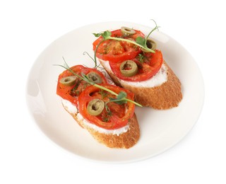 Delicious ricotta bruschettas with sliced tomatoes, olives and greens isolated on white