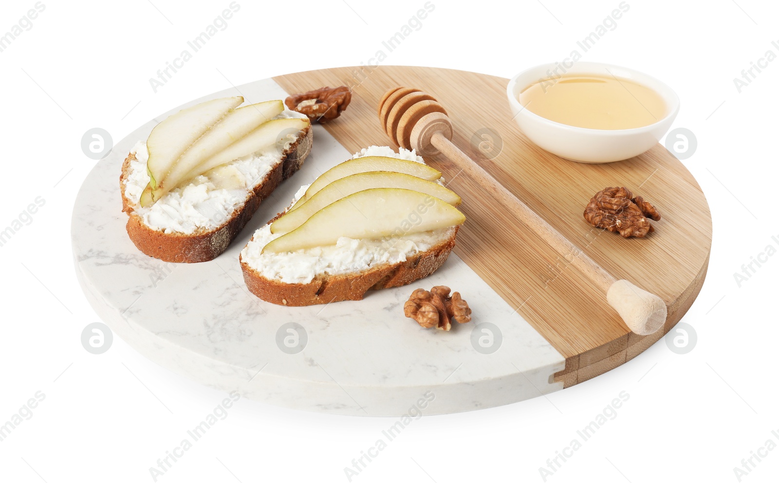 Photo of Delicious ricotta bruschettas with pear, honey and walnut isolated on white