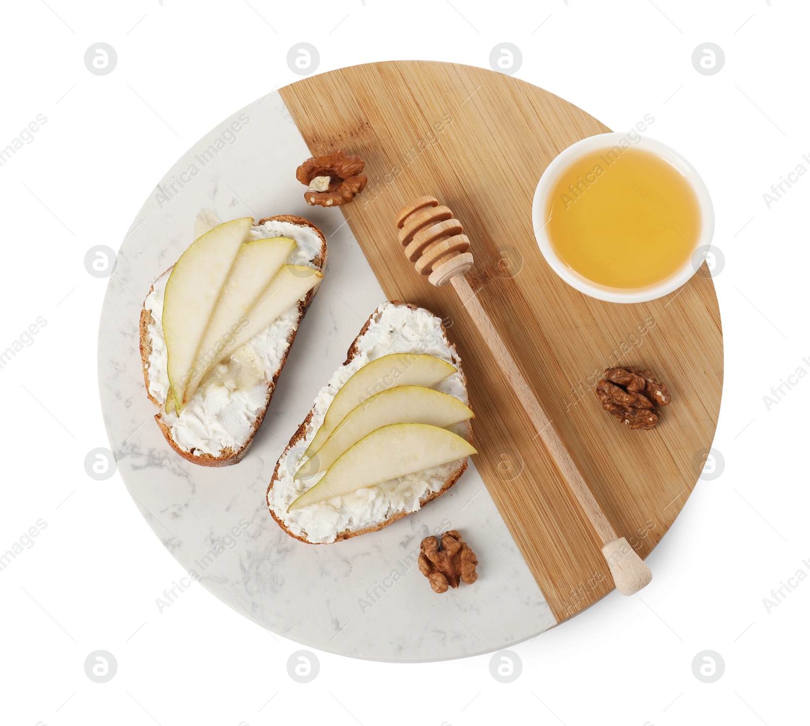 Photo of Delicious ricotta bruschettas with pear, honey and walnut isolated on white, top view