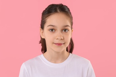 Photo of Portrait of beautiful girl on pink background