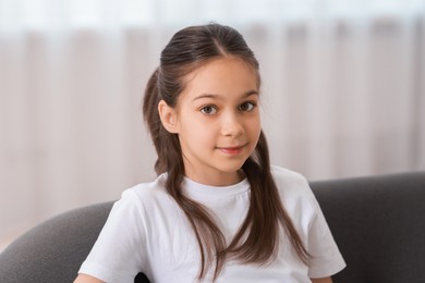 Portrait of beautiful little girl indoors. Cute child