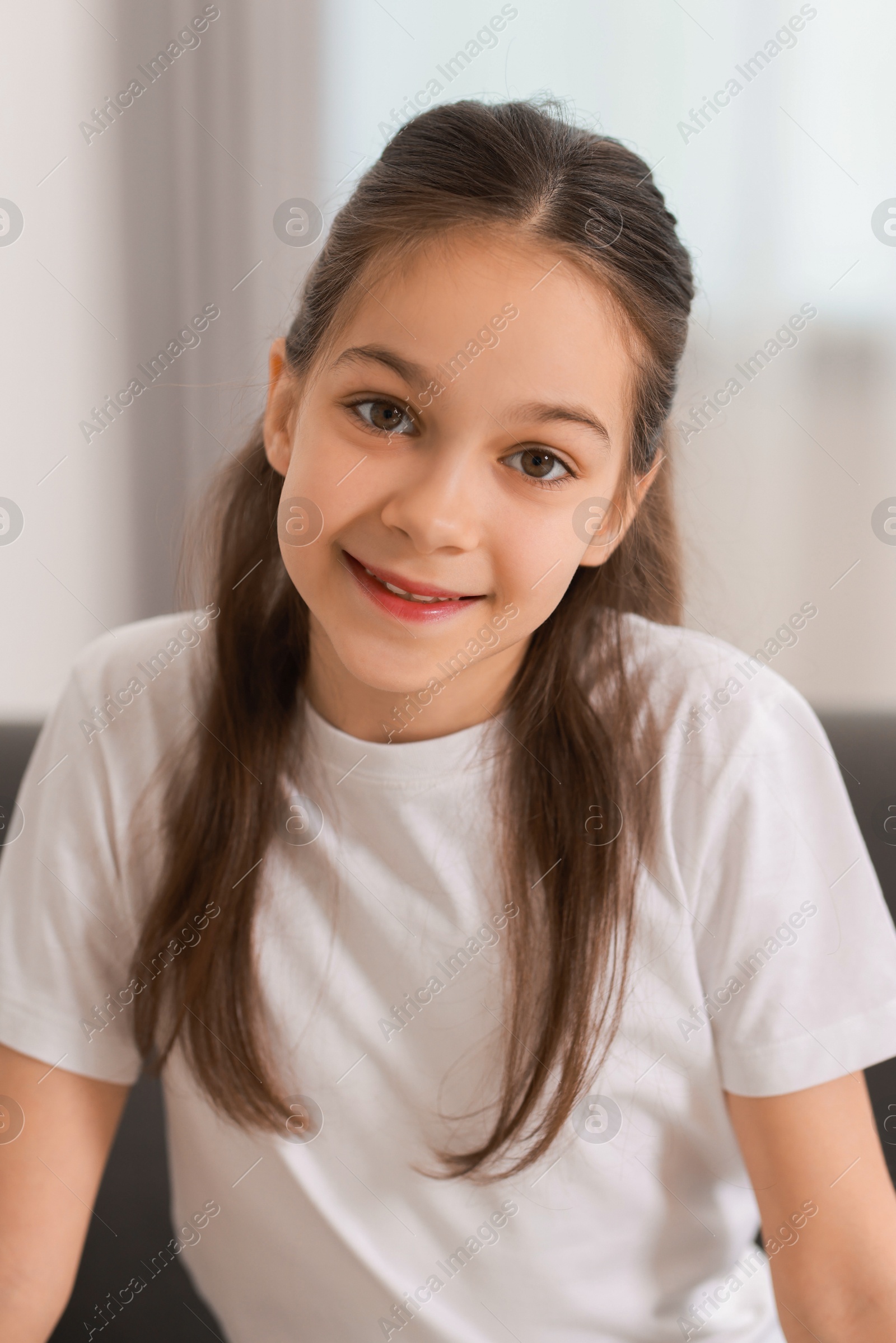 Photo of Portrait of beautiful little girl indoors. Cute child