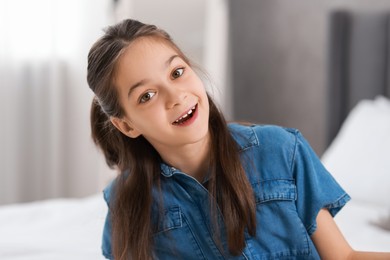 Photo of Portrait of happy little girl indoors. Cute child