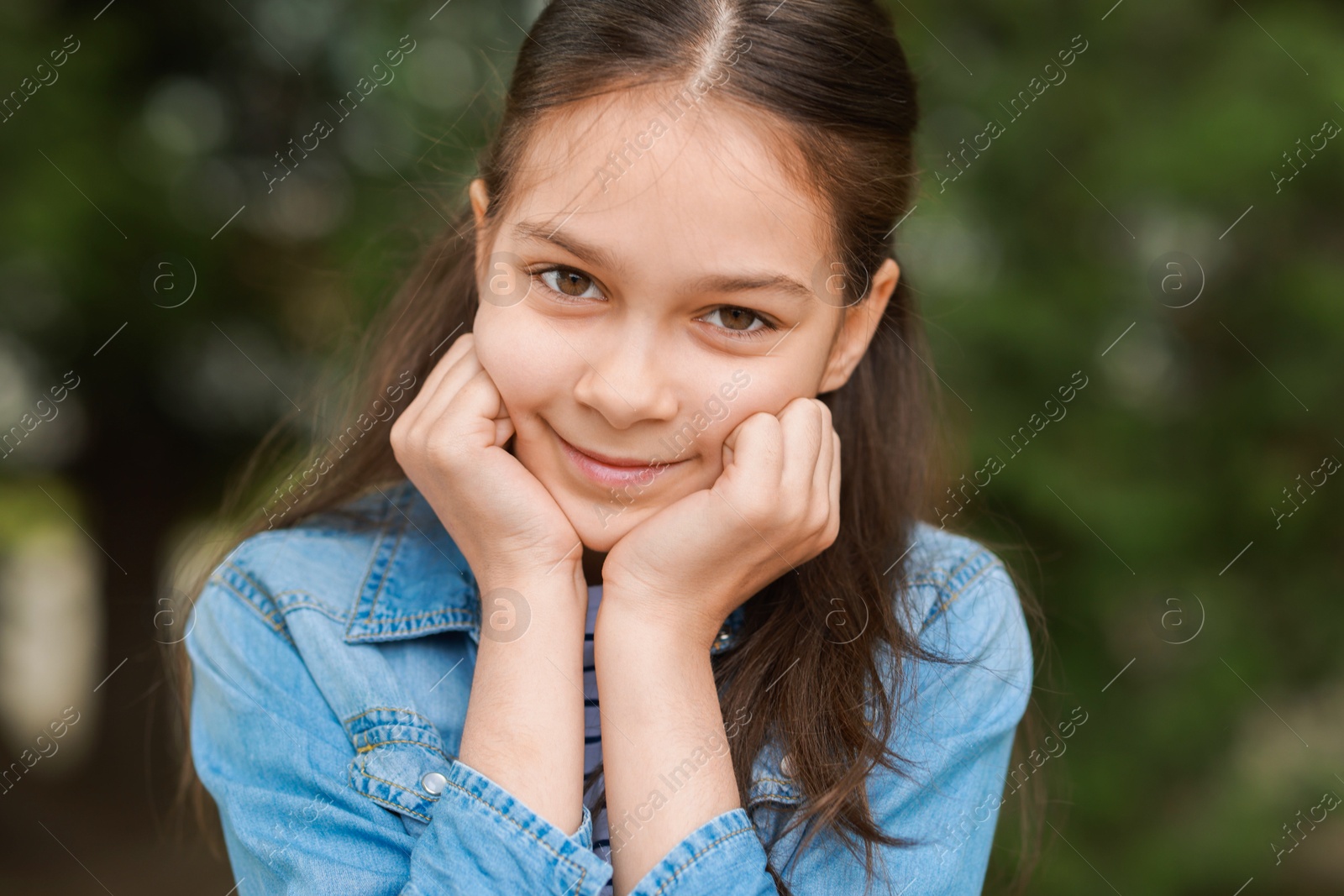 Photo of Portrait of beautiful little girl outdoors. Cute child