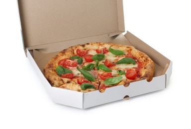 Photo of Delicious Margherita pizza in cardboard box isolated on white