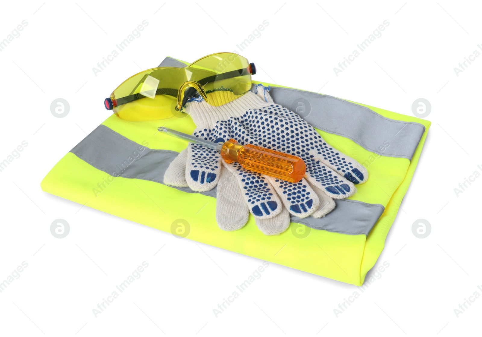 Photo of Protective gloves, goggles, screwdriver and reflective vest isolated on white