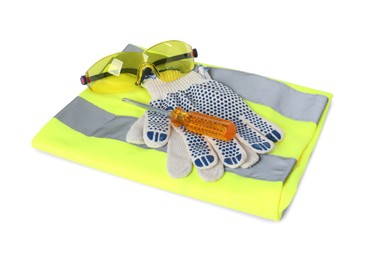 Protective gloves, goggles, screwdriver and reflective vest isolated on white