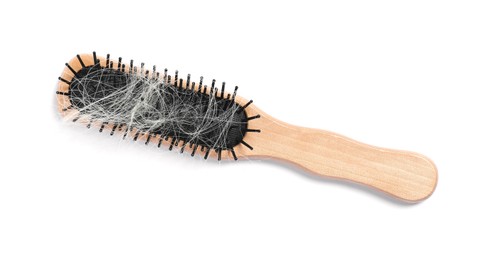 Photo of Wooden brush with lost hair isolated on white, top view