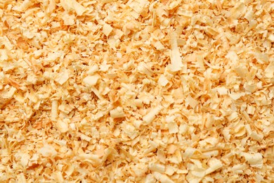 Photo of Dry natural sawdust as background, top view