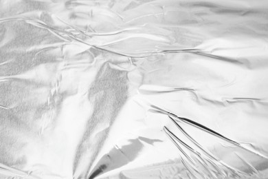 Crumpled silver foil as background, above view