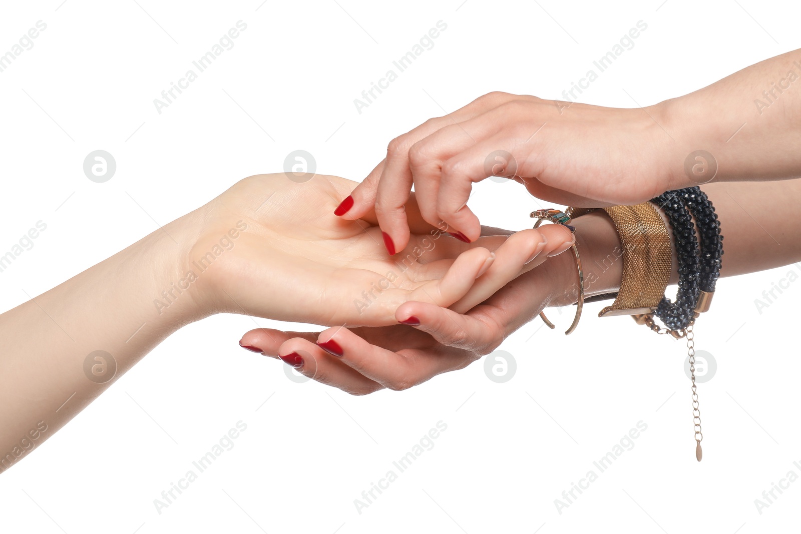 Photo of Fortune teller reading lines on woman's palm against white background. Chiromancy