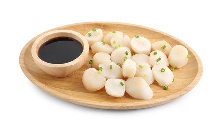 Photo of Raw scallops with green onion and soy sauce isolated on white