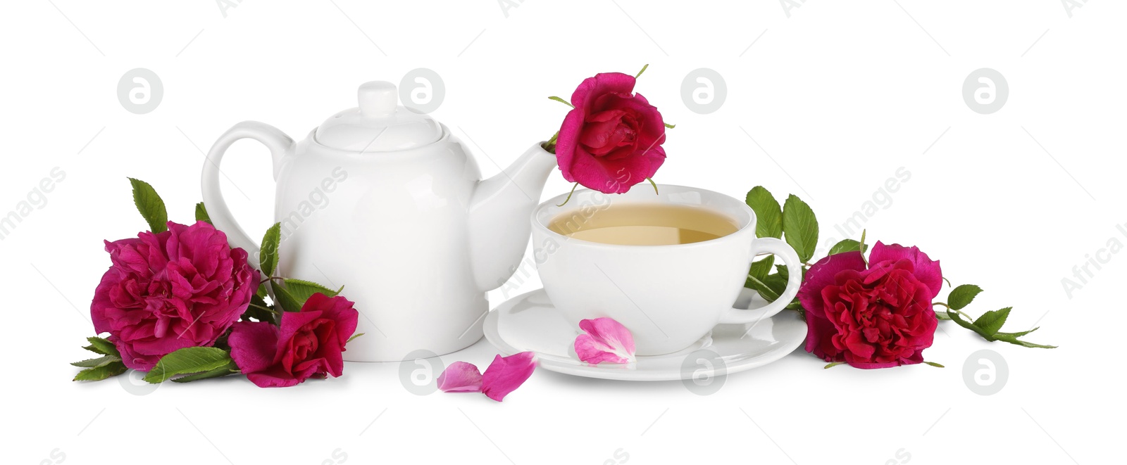 Photo of Aromatic herbal tea with rose flowers isolated on white