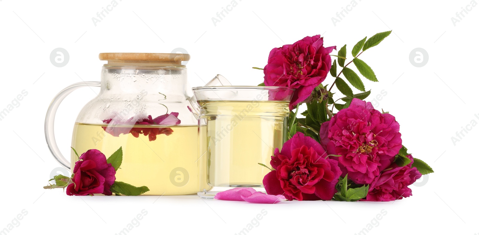 Photo of Aromatic herbal tea with rose flowers isolated on white