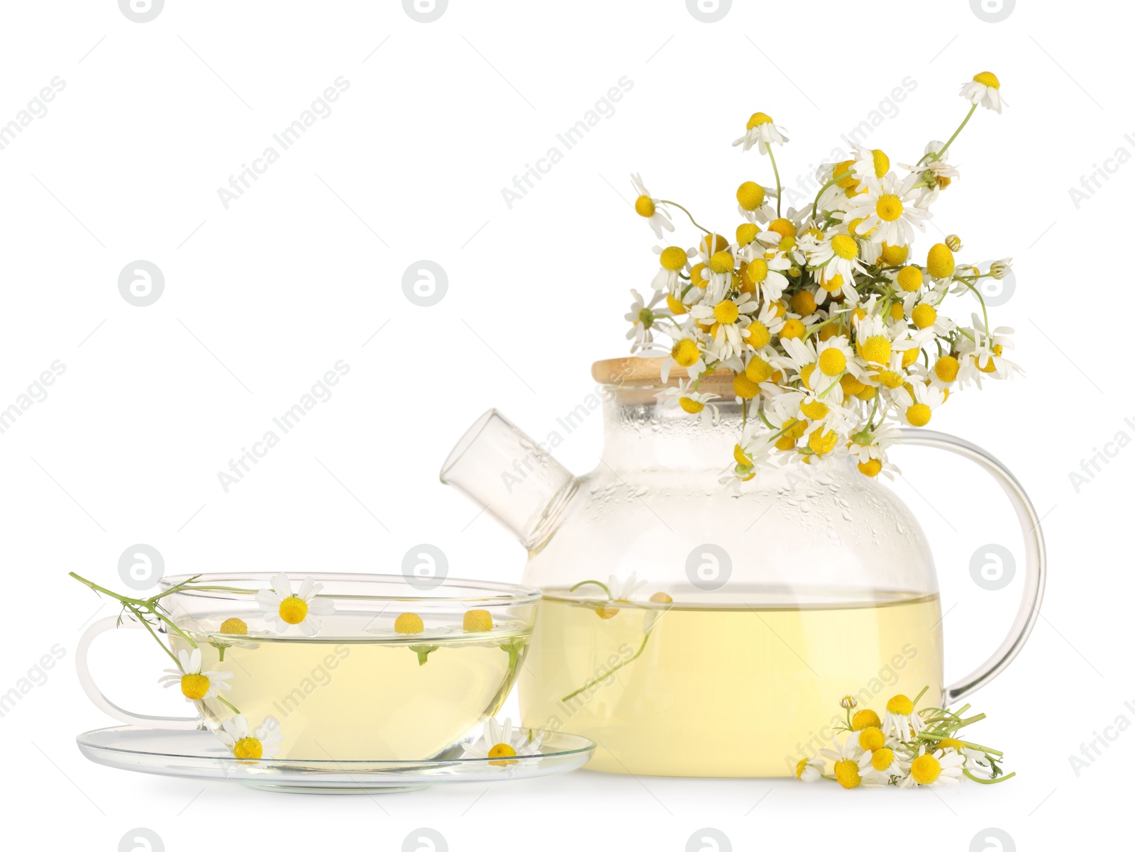 Photo of Aromatic herbal tea with chamomile flowers isolated on white