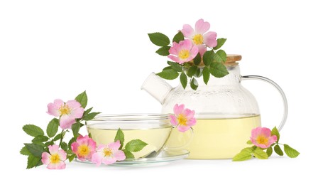 Photo of Aromatic herbal tea with rose hip flowers isolated on white