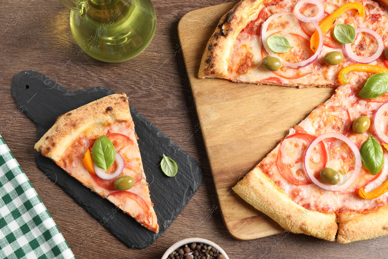 Photo of Delicious vegetarian pizza served on wooden table, flat lay