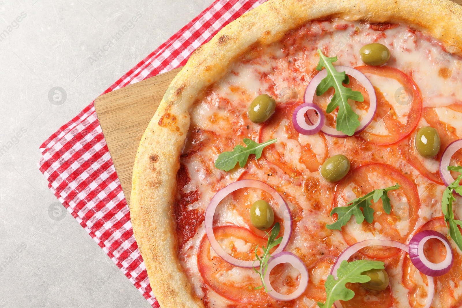 Photo of Delicious vegetarian pizza on light grey background, top view