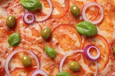 Photo of Delicious vegetarian pizza with basil as background, closeup