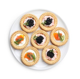 Delicious canapes with salmon and caviar isolated on white, top view