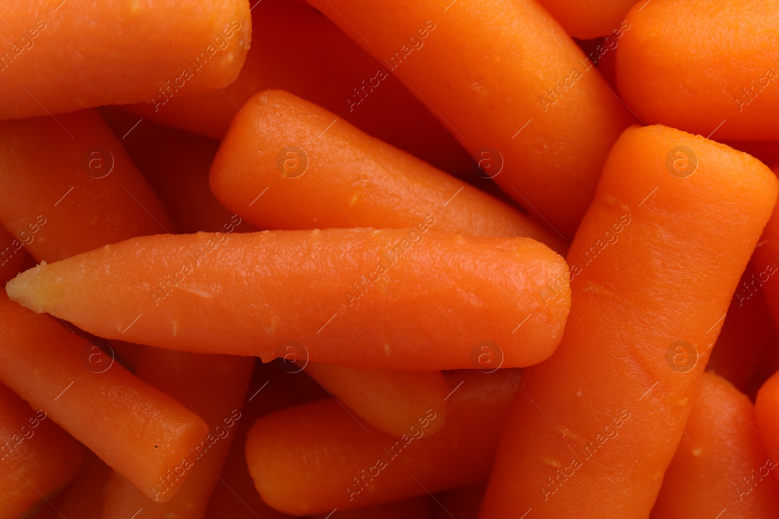 Photo of Many baby carrots as background, top view