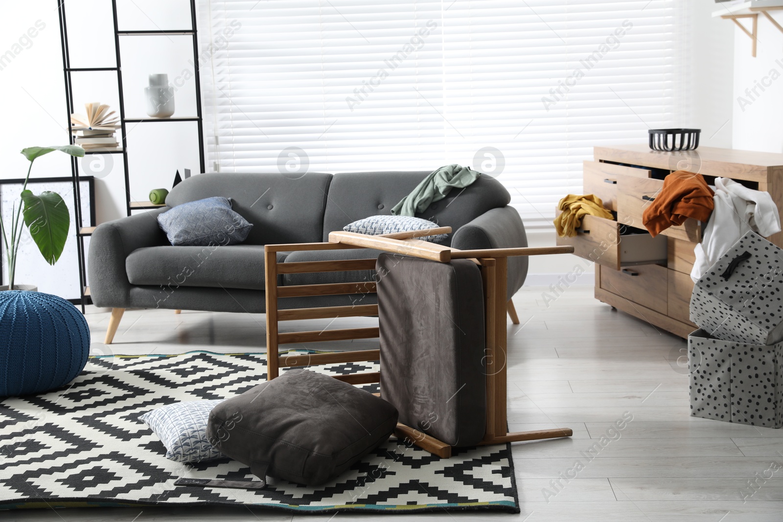 Photo of View on messy living room interior after robbery