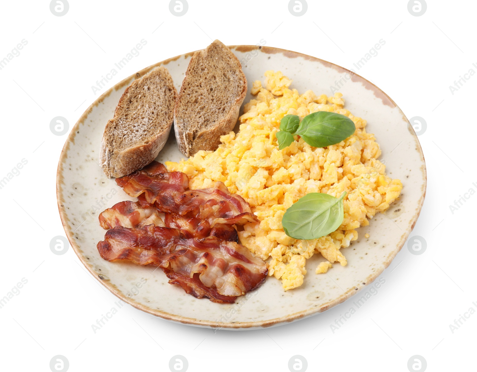 Photo of Delicious scrambled eggs with bacon and basil in plate isolated on white