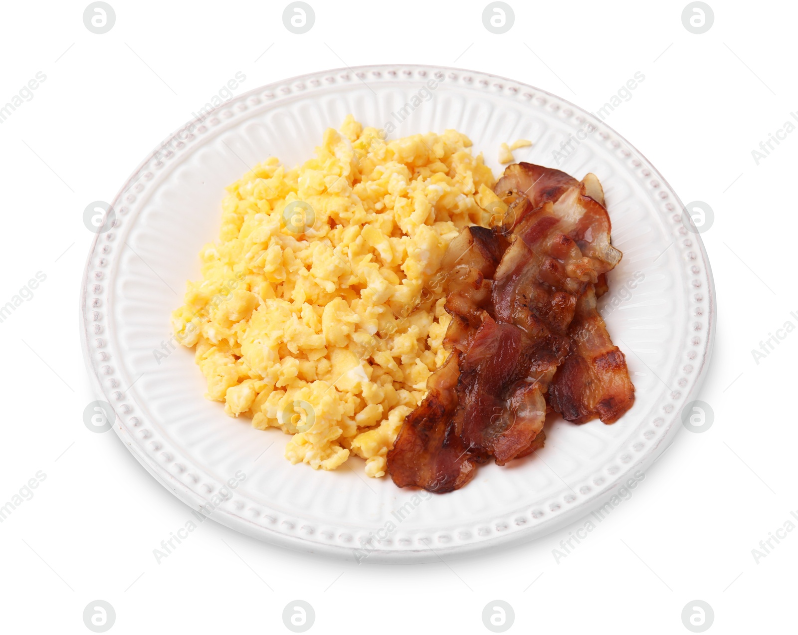 Photo of Delicious scrambled eggs with bacon on plate isolated on white