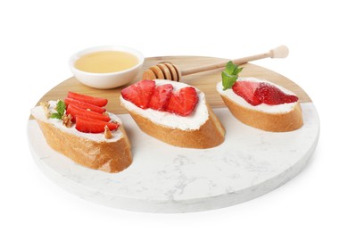 Delicious bruschetta with ricotta cheese, mint, walnuts, strawberries and honey isolated on white