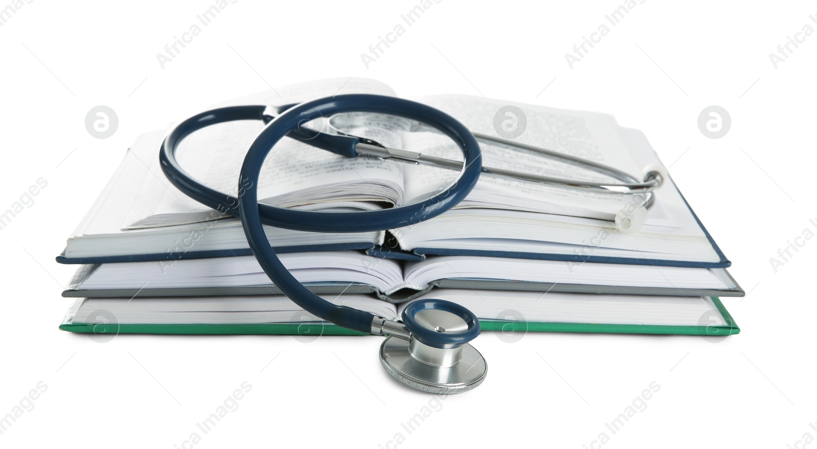 Photo of One new medical stethoscope and books isolated on white