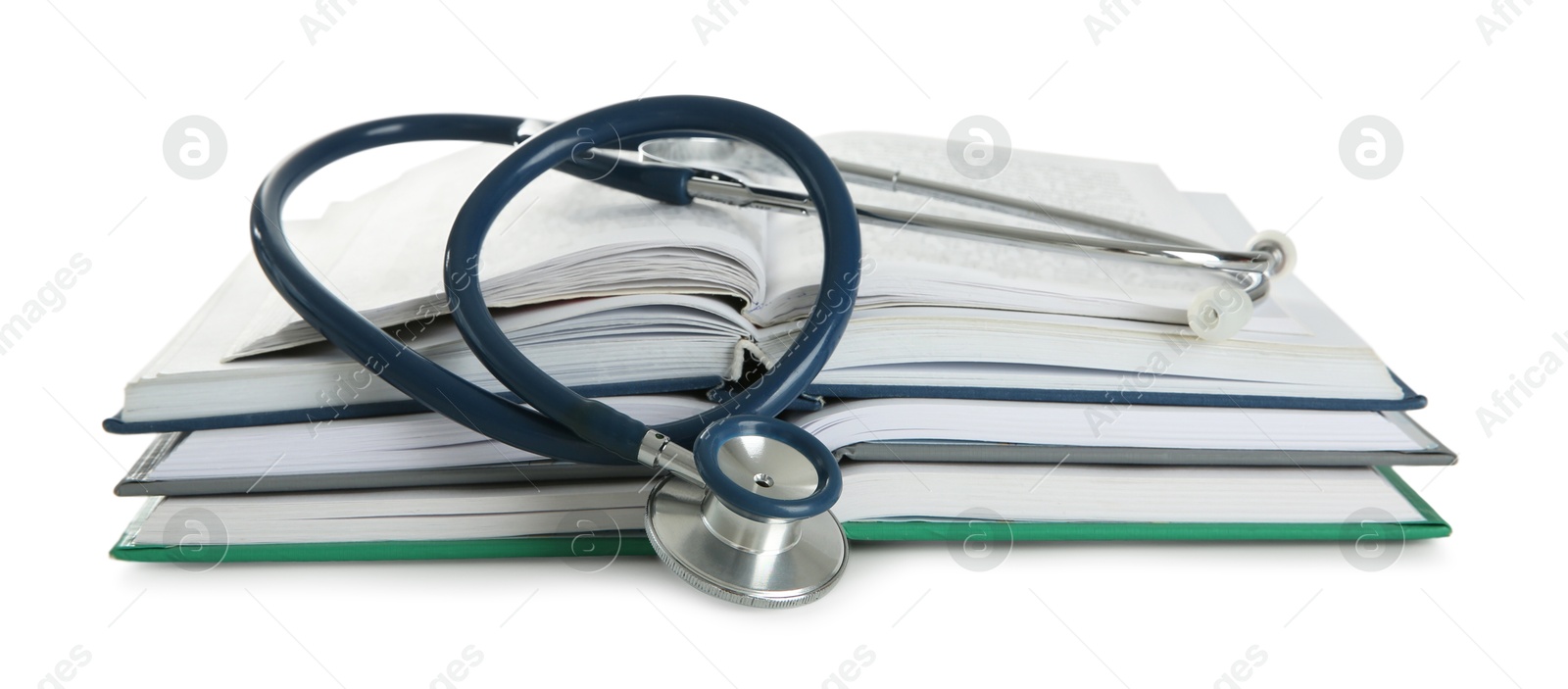 Photo of One new medical stethoscope and books isolated on white