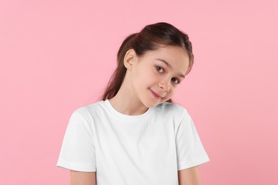 Portrait of beautiful girl on pink background
