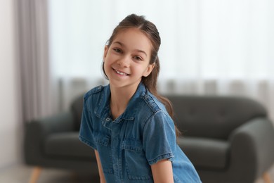 Photo of Portrait of happy little girl indoors. Cute child