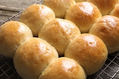 Delicious dough balls on wooden table, closeup