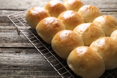 Many delicious dough balls on wooden table