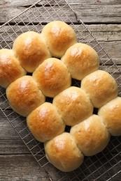 Photo of Delicious dough balls on wooden table, top view