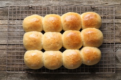 Photo of Delicious dough balls on wooden table, top view