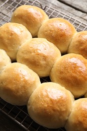 Photo of Many delicious dough balls on wooden table