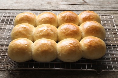 Photo of Many delicious dough balls on wooden table