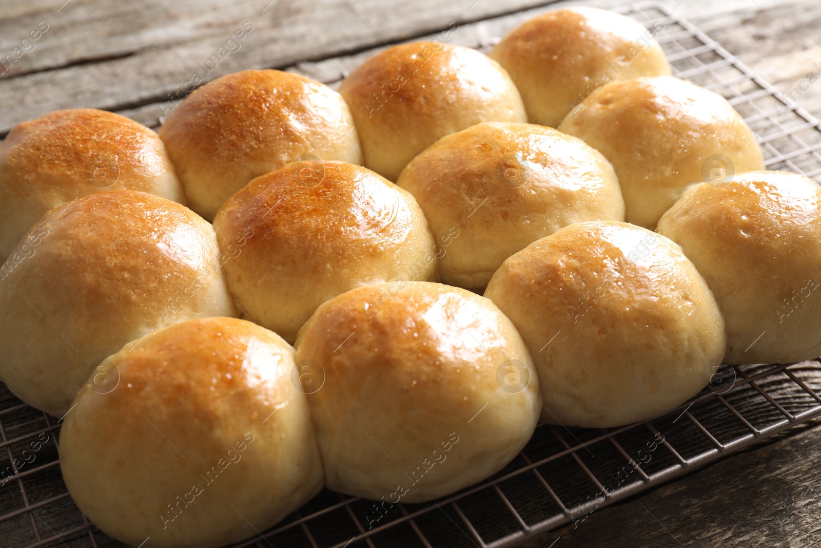 Photo of Many delicious dough balls on wooden table