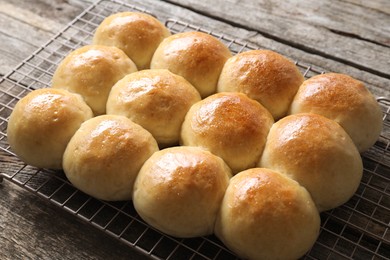 Many delicious dough balls on wooden table