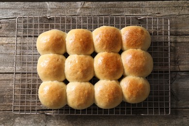 Photo of Delicious dough balls on wooden table, top view