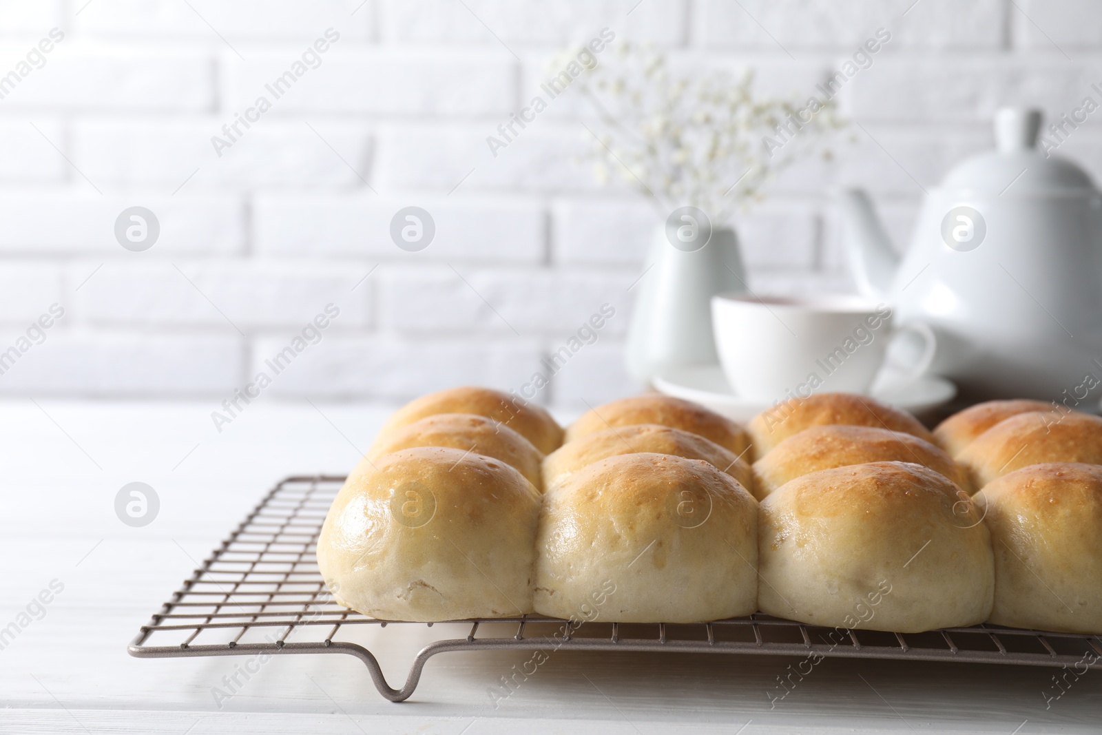 Photo of Delicious dough balls on white wooden table