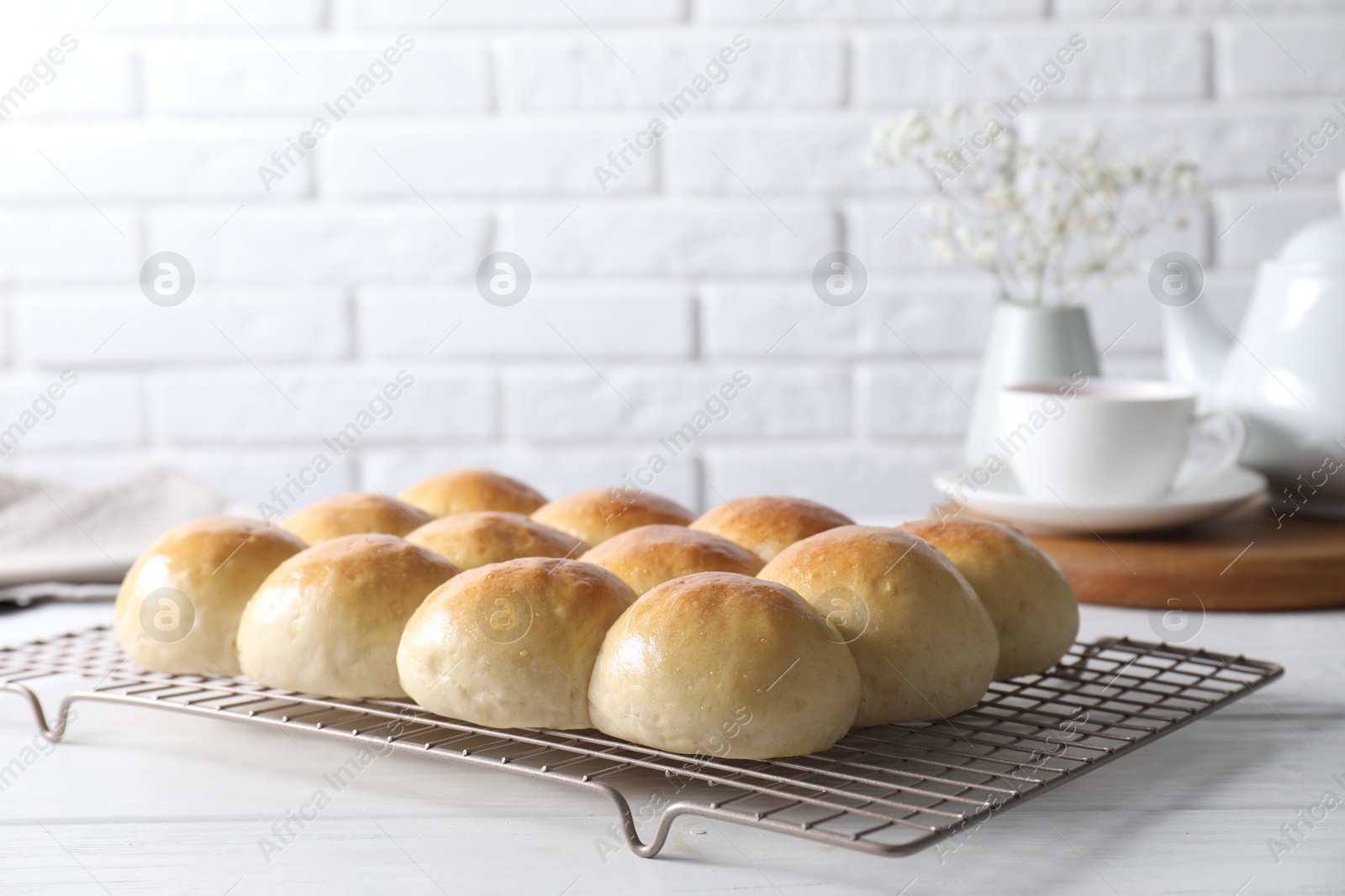 Photo of Delicious dough balls on white wooden table