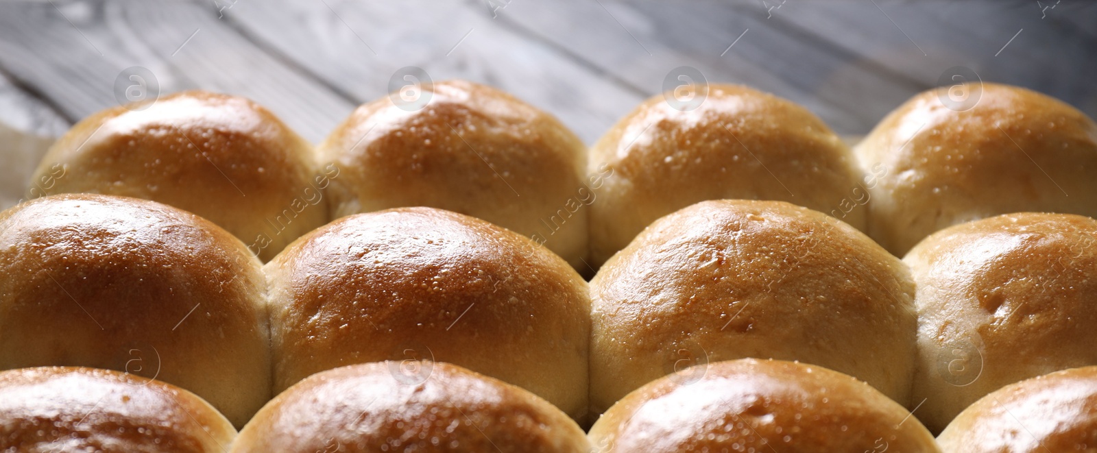 Photo of Many delicious dough balls on table, closeup