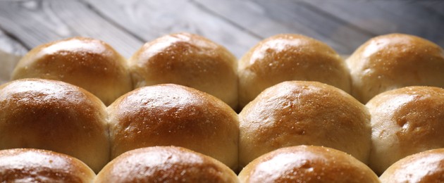 Many delicious dough balls on table, closeup