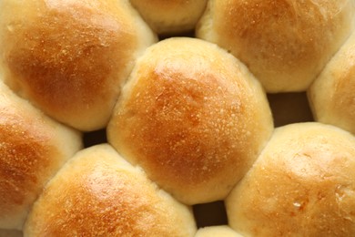 Photo of Many delicious dough balls as background, top view